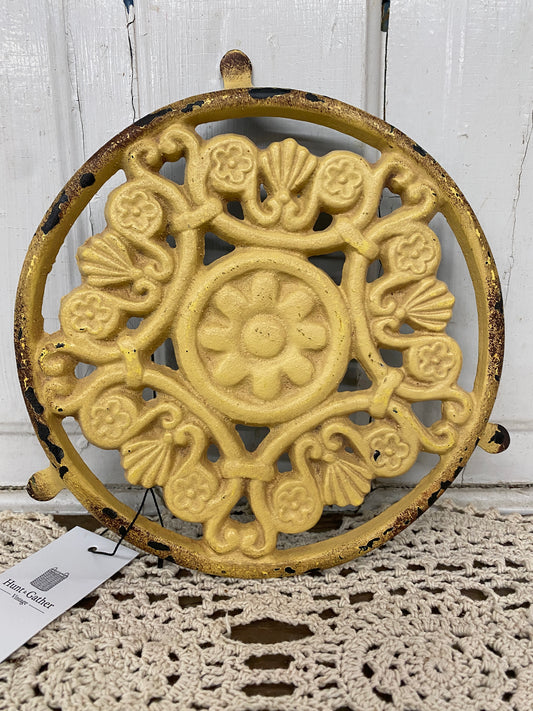YELLOW IRON TRIVET